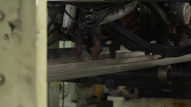 Metal sheet being processed in a factory