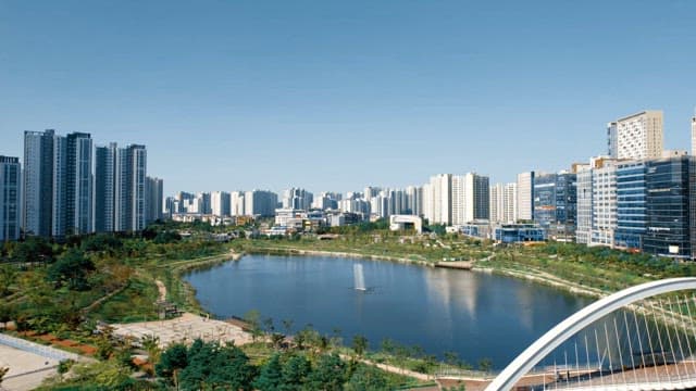 Cityscape with a lake and skyscrapers