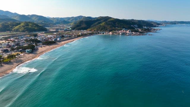 Coastal town with mountains and sea