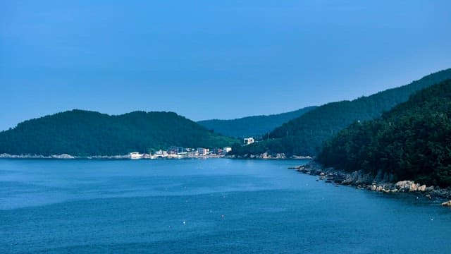 Tranquil Coastal Village by Verdant Hills