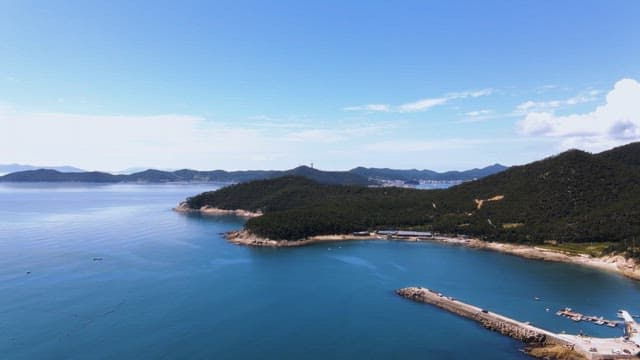 Serene coastal landscape with blue sea