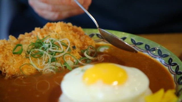 Plate of curry rice with fried cutlet