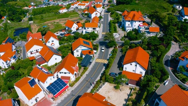 Aerial View of a Quaint Green Hillside Village