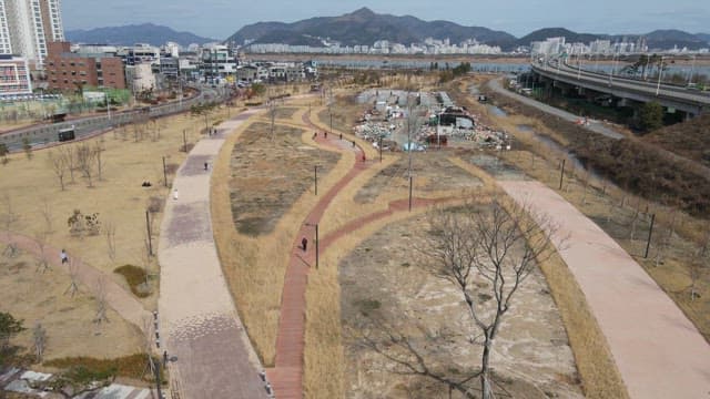Park with walking paths and city view