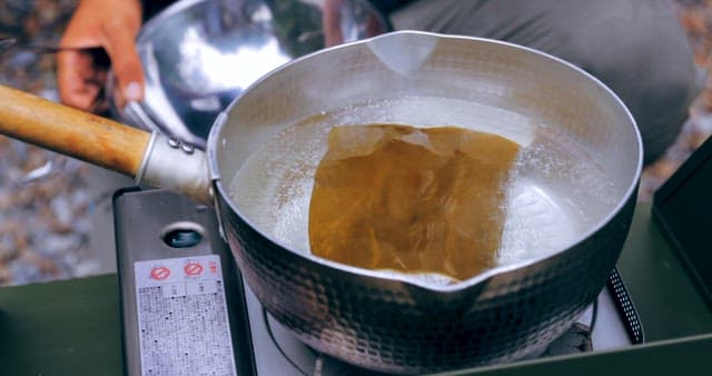 Preparing Gravy for Soup on a Portable Stove