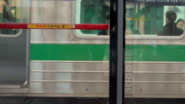 Subway train stopping at platform