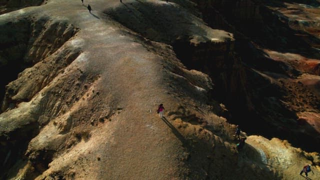 Hikers Exploring a Vast Desert Landscape