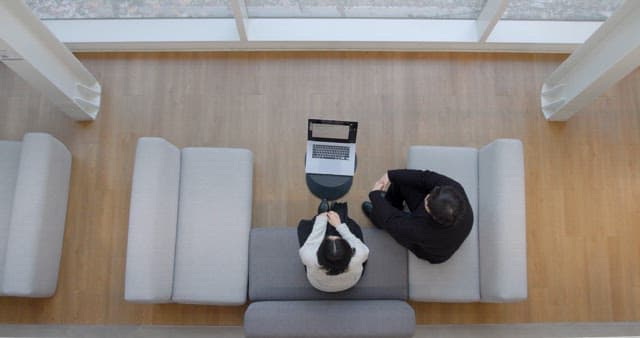 Coworkers Greeting Each Other in the Office