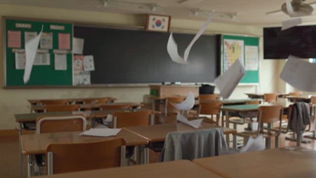 Papers Flying Around an Empty Classroom