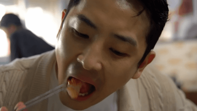 Man enjoying a meal indoors