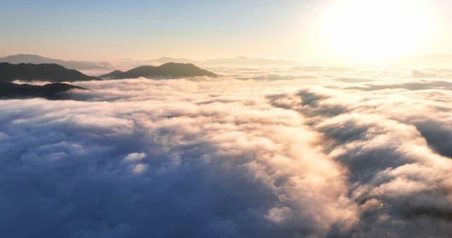 Sunrise over clouds and mountains