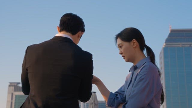 Two colleagues discussing on a rooftop