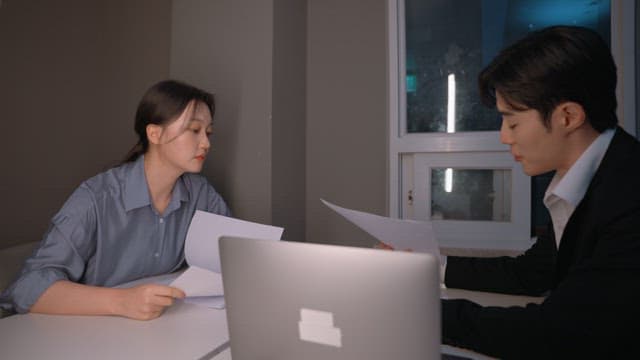 Two colleagues working late at night