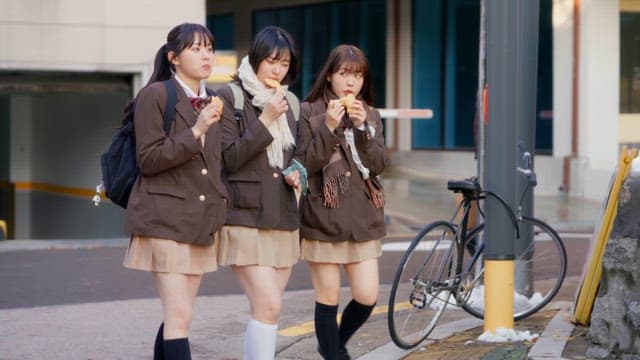 Students eating bungeoppang in winter