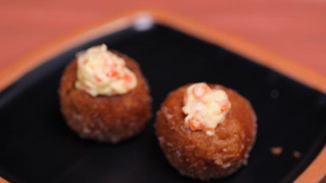 Glutinous rice donut made of carrot on a plate