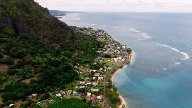 Coastal Town Nestled by Lush Mountain