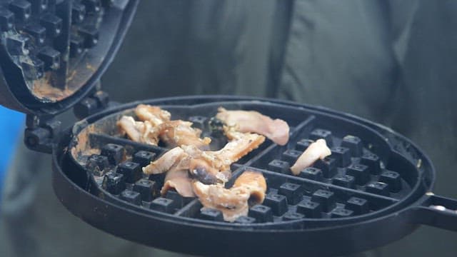 Clams grilled in a waffle pan