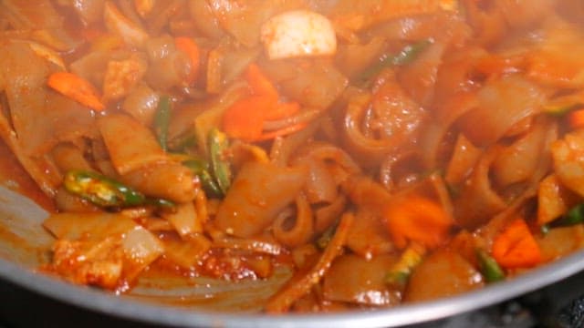 Spicy Stir-Fried Pork Rinds Cooked in a Hot Pan