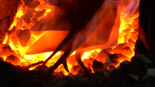 Metal being heated in a furnace