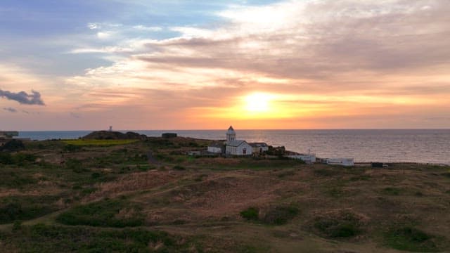 Serene coastal landscape at sunset