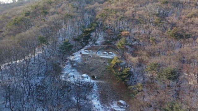 Snowy Mountainside with Some Graves