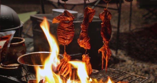 Sizzling squid being cooked on a grill