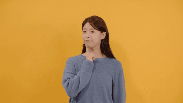 Woman lost in thought, resting her finger on her chin