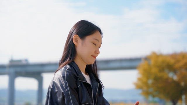 Woman listening to music outdoors