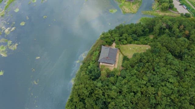 Aerial View of a Lone Hanok Surrounded by Greenery