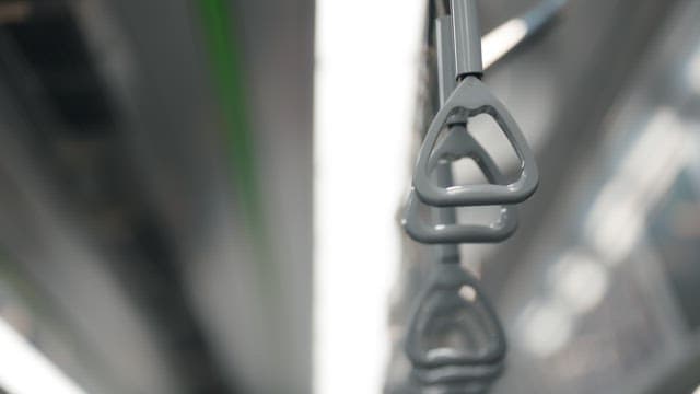 Gray handle in a moving subway