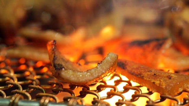 Pork rinds sizzling on the grill