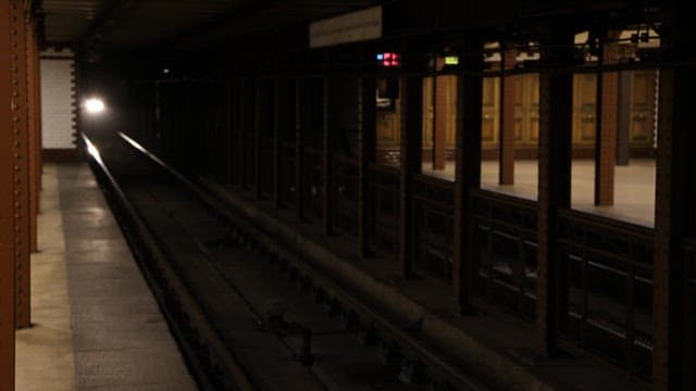 Subway Train Approaching Underground Station