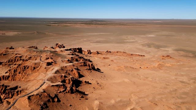 Expansive desert landscape with cliffs