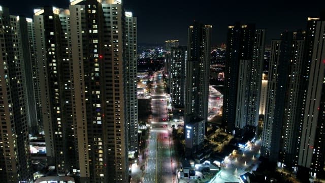 Night View Illuminated by the Lights of Buildings and Traffic in a Bustling City