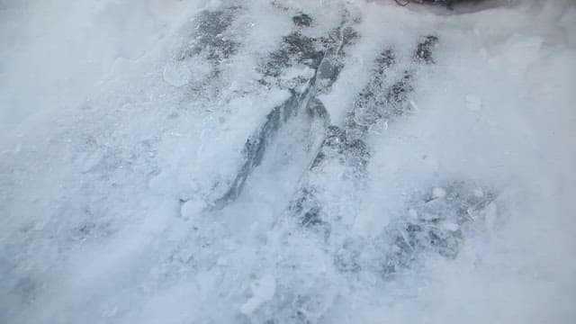 Chopping Hard Ice with an Axe