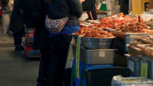 Bustling market with various Korean dishes