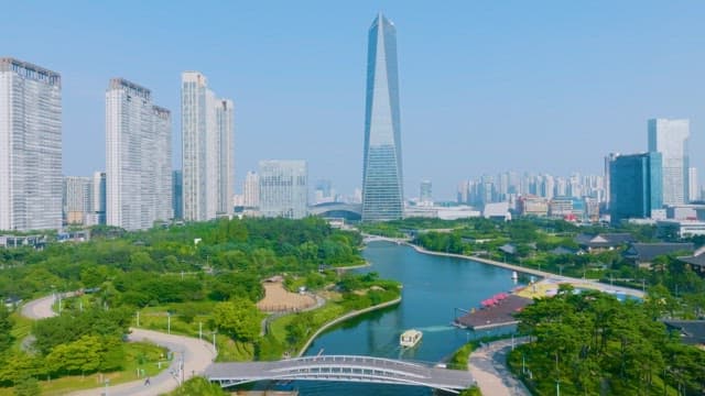 Urbanscape with Skyscrapers and Park with Green Spaces