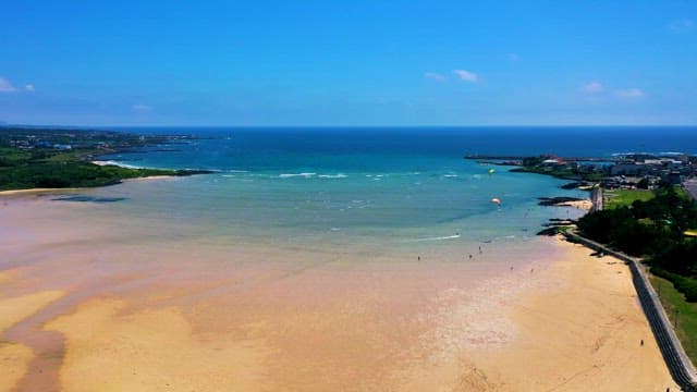 Quiet Beach with People Enjoying Leisure Activities