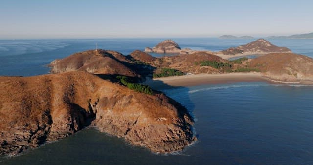 Serene Coastal Landscape with Hills and Sea