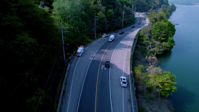 Scenic Road Alongside a Lake