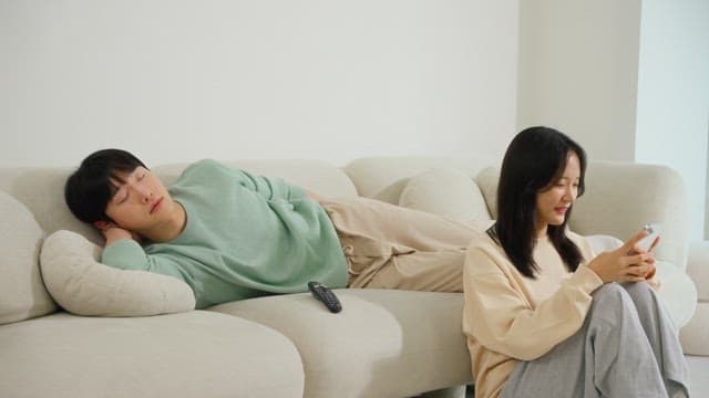Two People Relaxing in a Bright Living Room