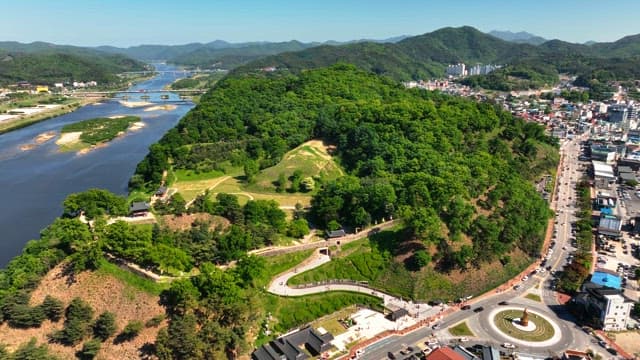 Scenic view of a river and lush hills
