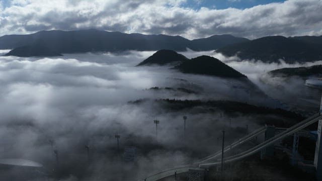 Misty and Cloudy Mountains and Valley at Dawn