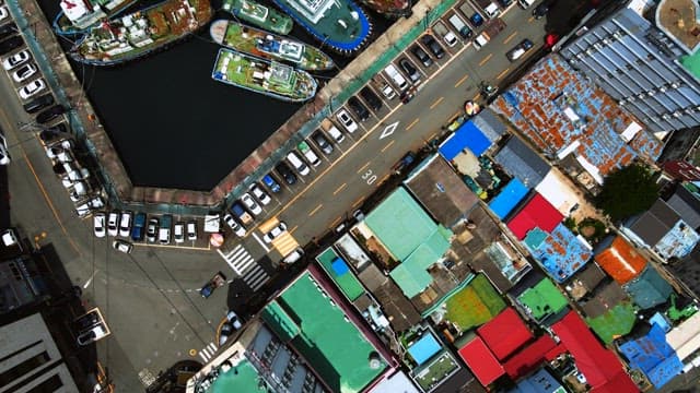 Aerial View of Docked Boats and City Street