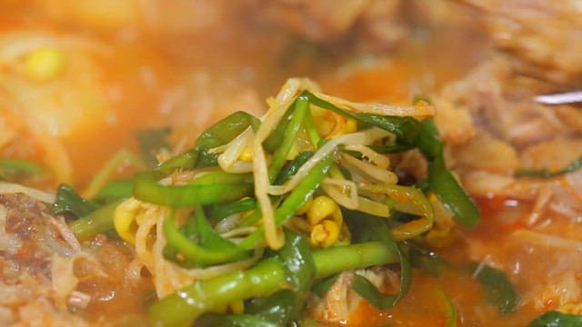 One chopstick of pork backbone stew meat with vegetables