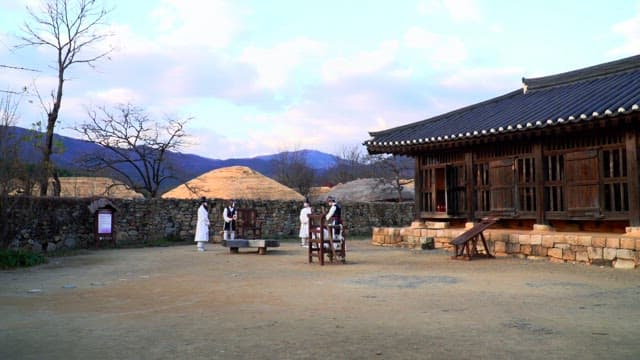 Traditional Korean village with model of people in hanbok