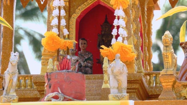 Vibrant altar adorned with flowers and statues