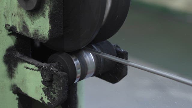 Metal being processed in a machine