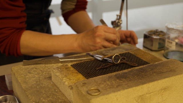 Artisan Crafting Metal Ring at a workshop