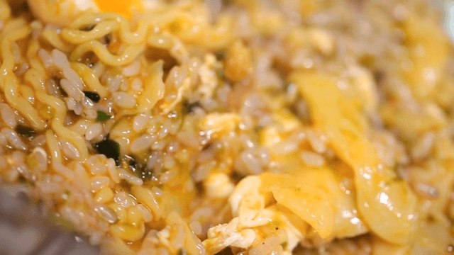 Mixing rice with ramyeon in a bowl